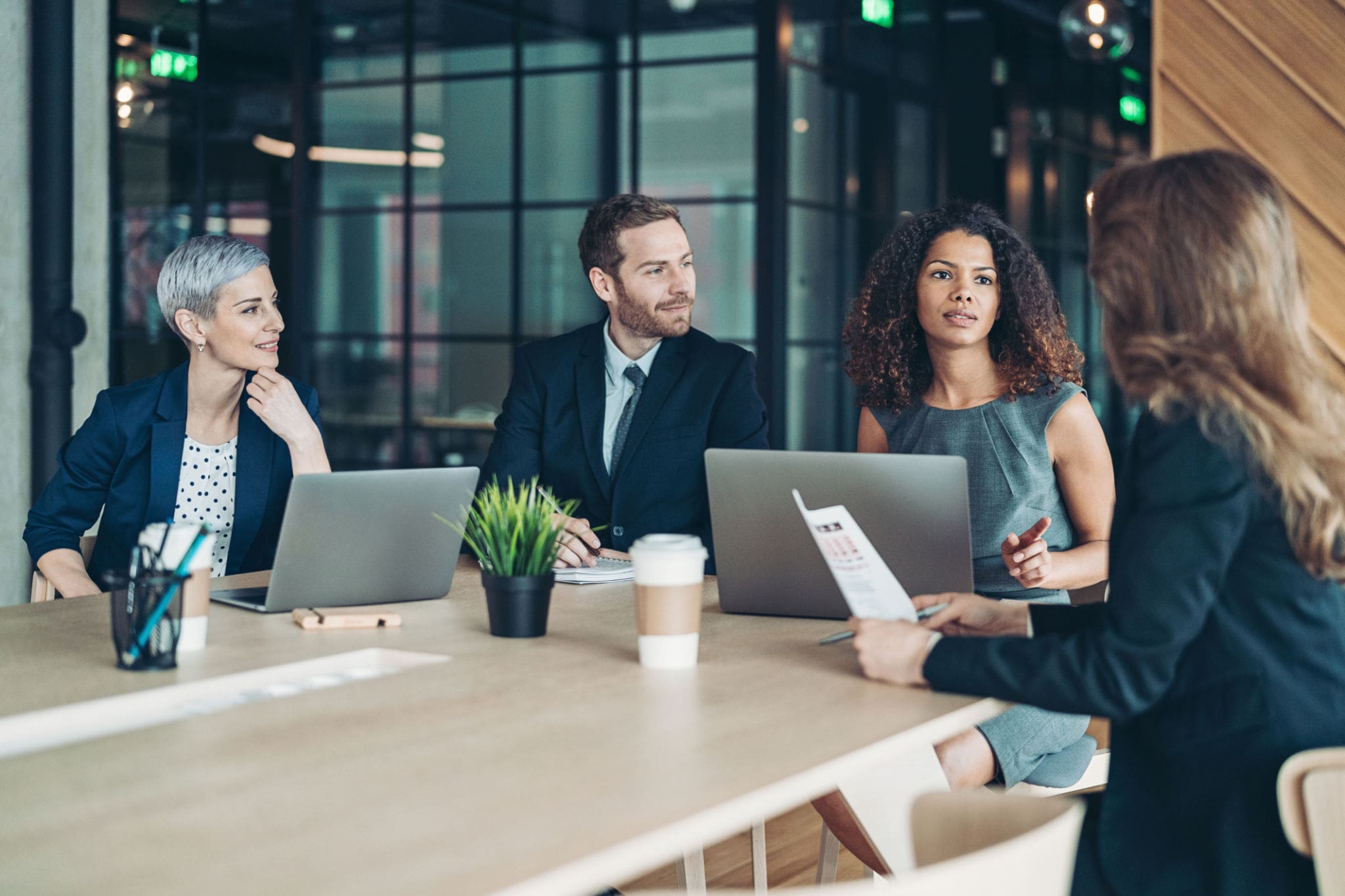 Business professionals in a meeting discussing